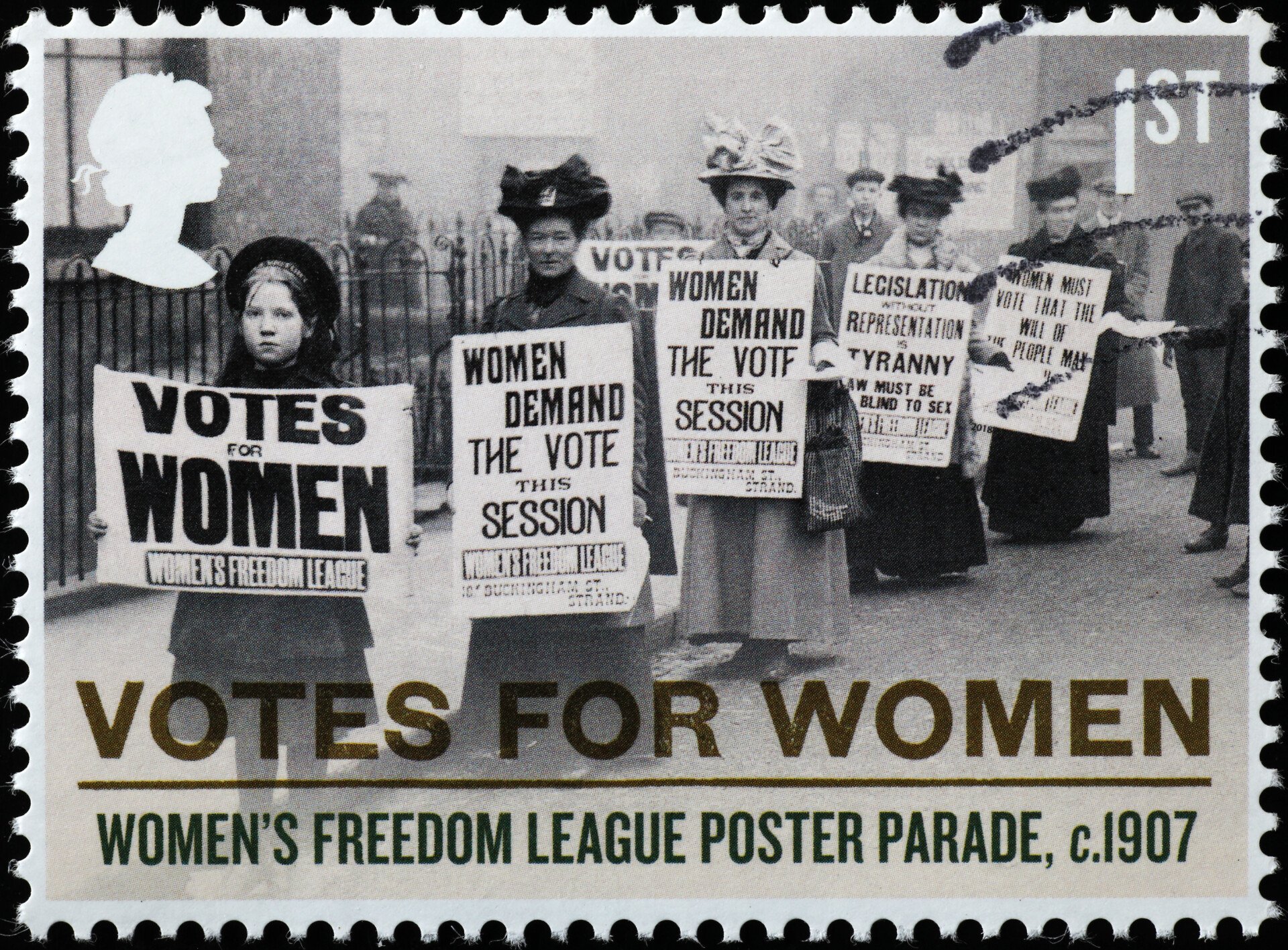 Liberal Feminism: Definition, Theory & Examples 1 A stamp displaying women holding votes for women placards circa 1907