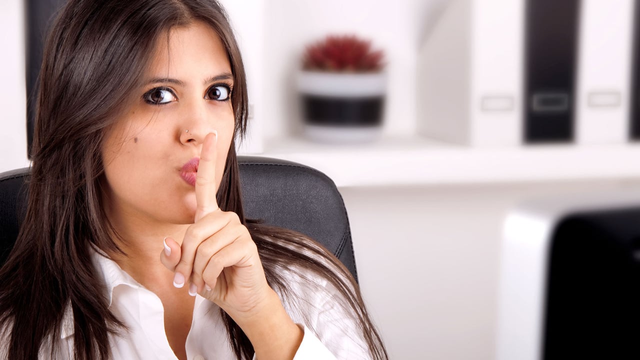 How to Recognize the Signs That Someone Is Lying 1 a woman holding a finger up to her lips