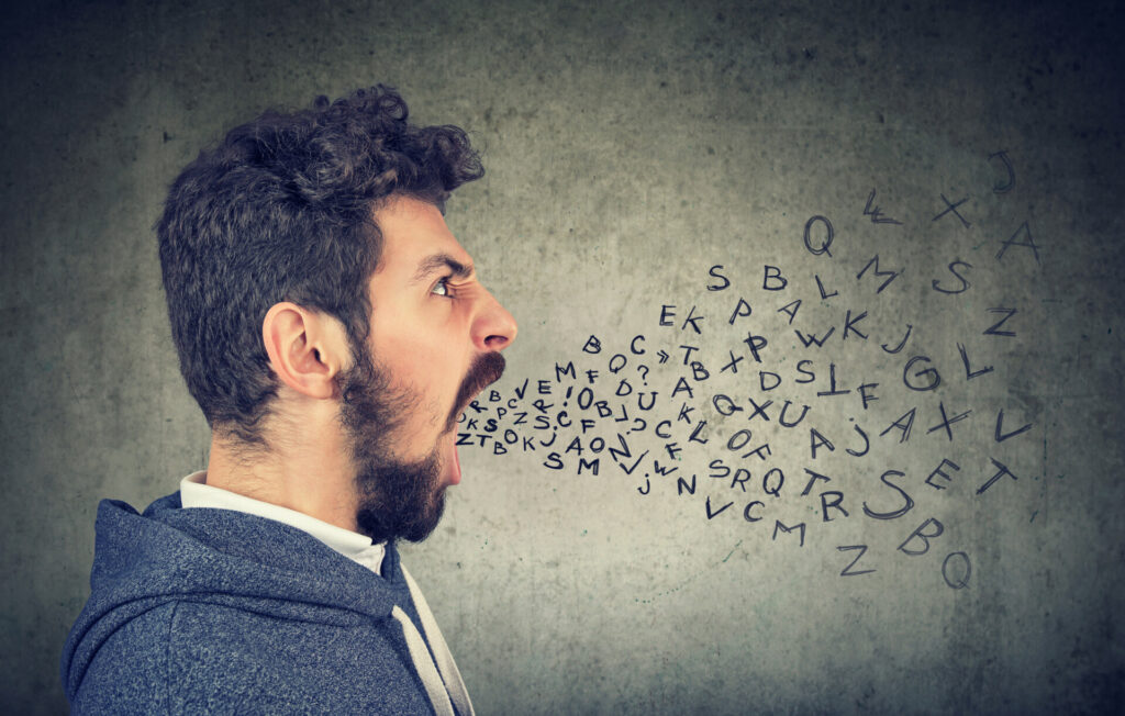 Signs of Verbal Abuse: Patterns To Watch For 1 Young man screaming with alphabet letters flying out of mouth